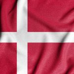 National flag of the Denmark. The main symbol of an independent country. An attribute of the large size of a democratic state.